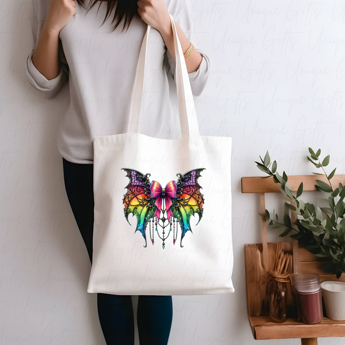 Tote Bag in White with a colourful butterfly design on a white background with abstract art