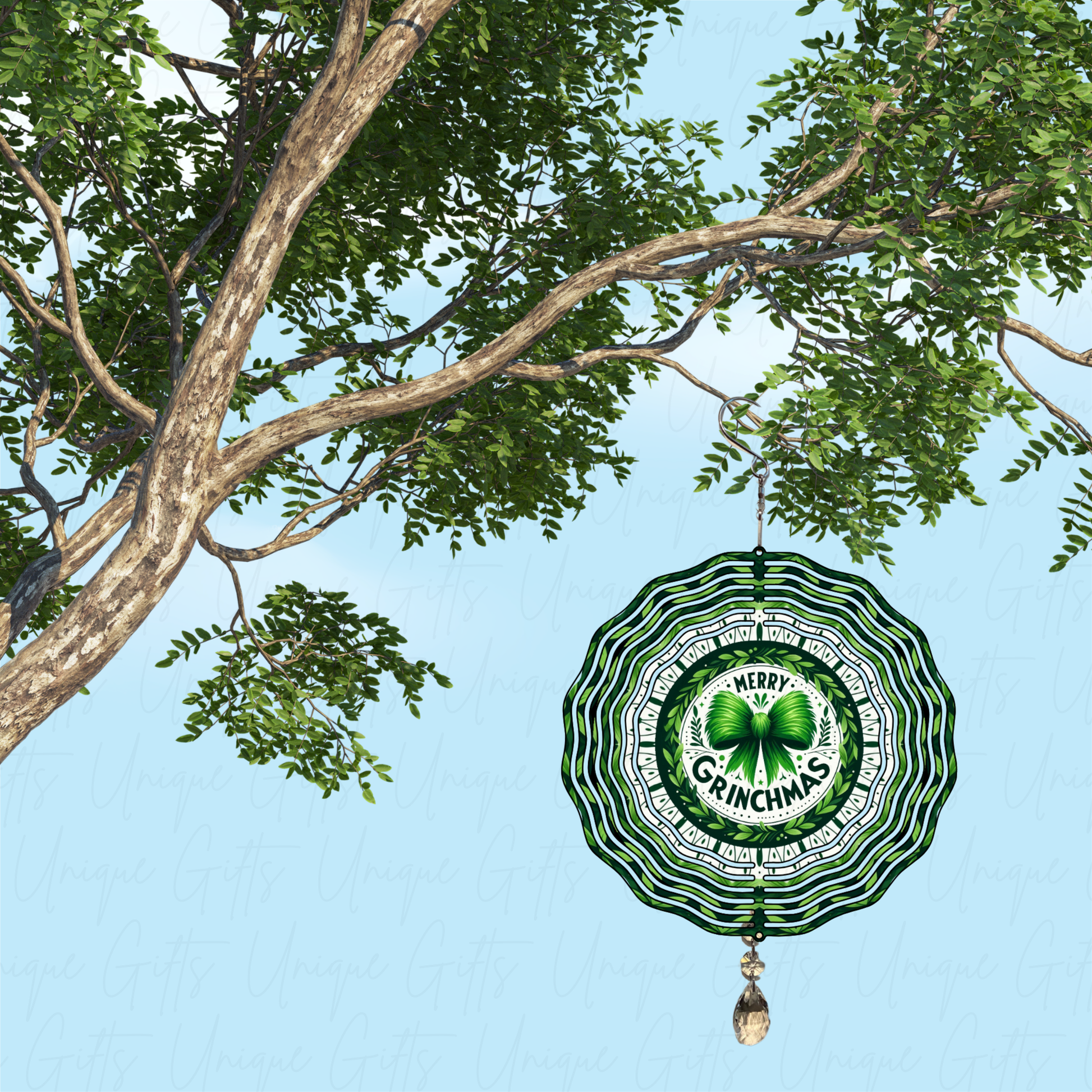 Decorative ornament with 'Merry Grinchmas' text hanging from a tree