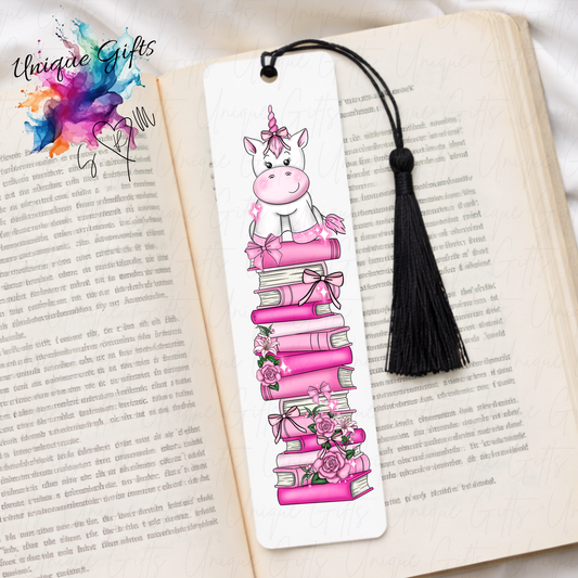 Personalised unicorn bookmark on pink book stack – magical reading gift – aluminium with black tassel