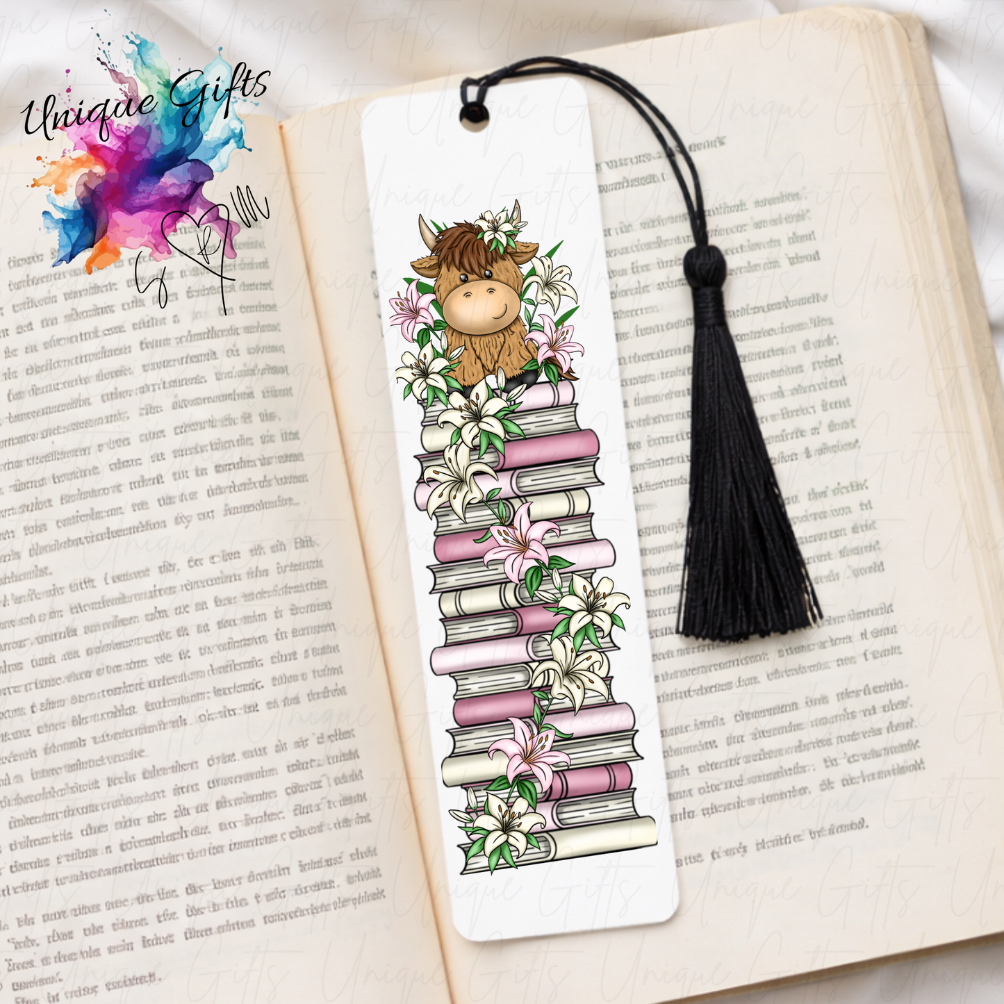 Personalised highland cow bookmark with lilies – book stack design – aluminium with black tassel