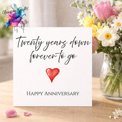 Twenty years down forever to go anniversary card displayed with flowers