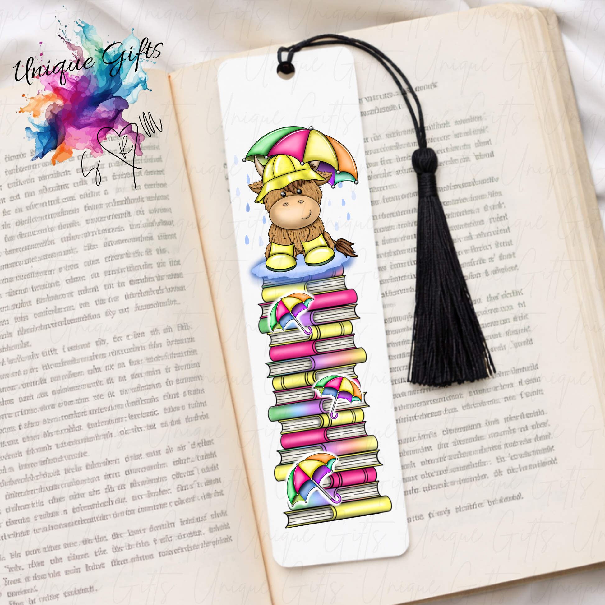 Personalised highland cow rainy day bookmark – cow with hat wellies and umbrella on book stack – aluminium with black tassel