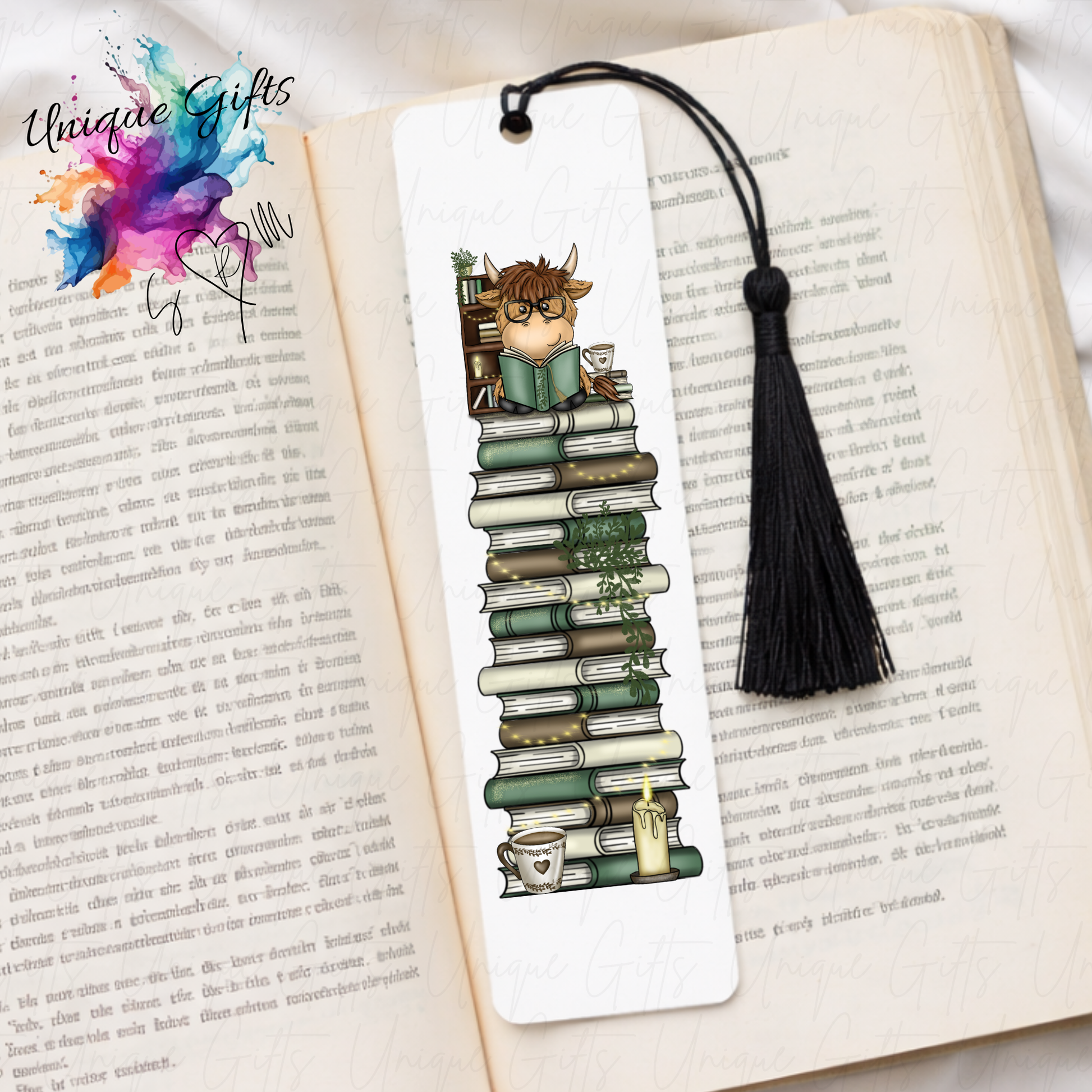 Personalised highland cow bookmark – reading cow on book stack – aluminium with black tassel